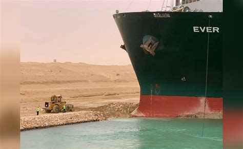 Tiny Bulldozer And A Giant Ship In Suez Canal Inspire Wave Of 